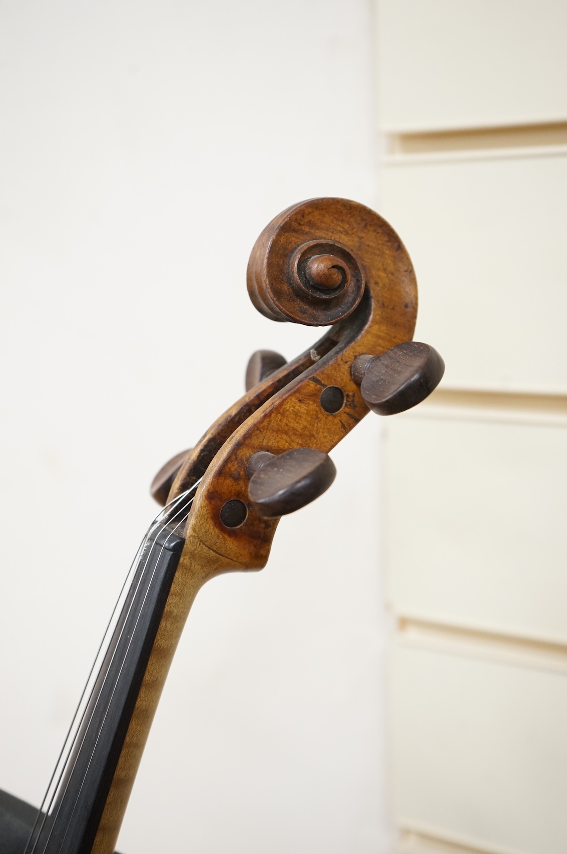 A late 18th century cased English violin, possibly after Richard Duke, length of body 35.5cm.